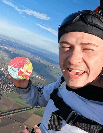 skydiver holding a yoghurt