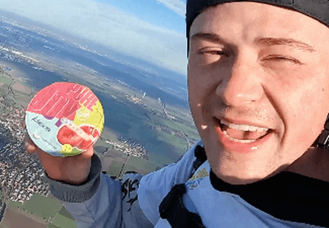 skydiver holding a yoghurt