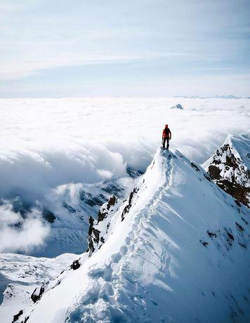 Man standing on mountain summit