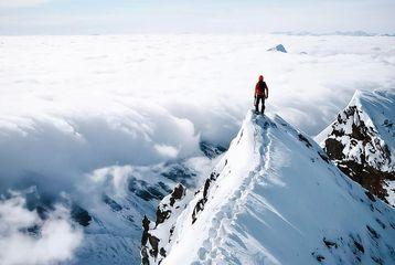 Man standing on mountain summit